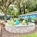 wooden lawn chairs near outdoor grilling area