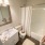 view of well lit bathroom with shower/tub combo